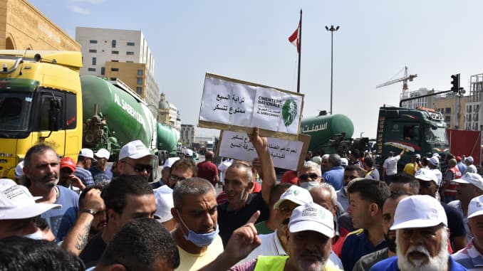 Concrete mixer drivers, unemployed due to the current economic crisis, block the roads with their concrete mixers and trucks around Martyrs' Square as they gather to protest against unemployment and power cuts in Beirut, Lebanon on July 06, 2020.