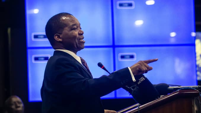 Zimbabwe Reserve Bank Governor John Mangudya delivers his Monetory Policy Statement in Harare on February 20, 2019, where he announced the establishment of an interbank foreign exchange market in the country officially abandoning the 1:1 exchange rate between the USD and the country's quasi currency the Bond note.