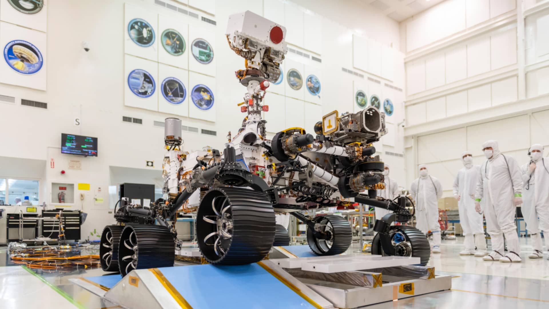 Engineers observe the first driving test for NASA's Mars 2020 Perseverance rover in a clean room at NASA's Jet Propulsion Laboratory in Pasadena, California, on Dec. 17, 2019.