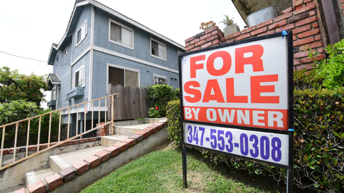 A "For Sale by Owner" sign is posted in front of property in Monterey Park, California on April 29, 2020.