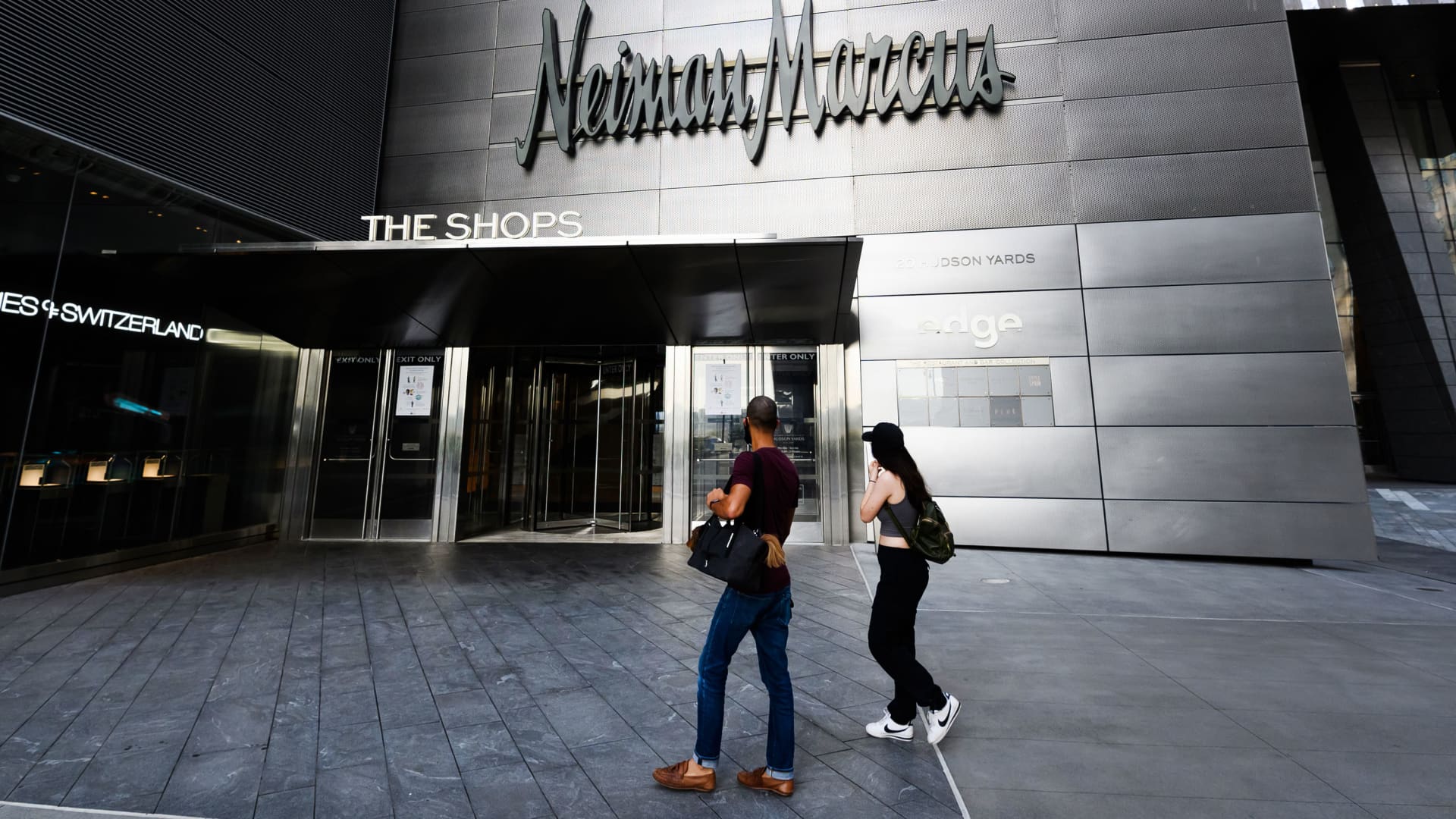 People walk outside of Neiman Marcus and The Shops at the Hudson Yards as the city continues Phase 4 of re-opening following restrictions imposed to slow the spread of coronavirus on July 31, 2020 in New York City.