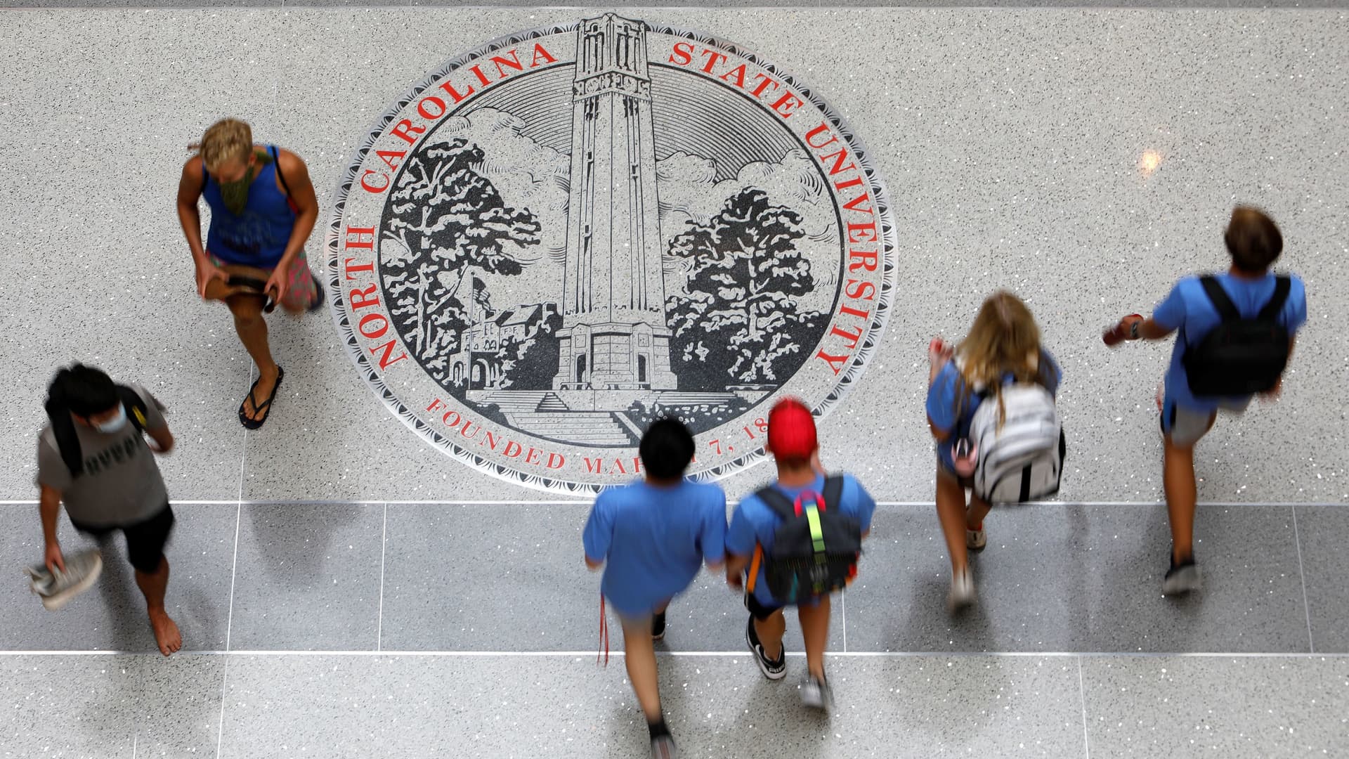 Students traverse the Talley Student Union at the campus of North Carolina State University in Raleigh, North Carolina, U.S. August 7, 2020.