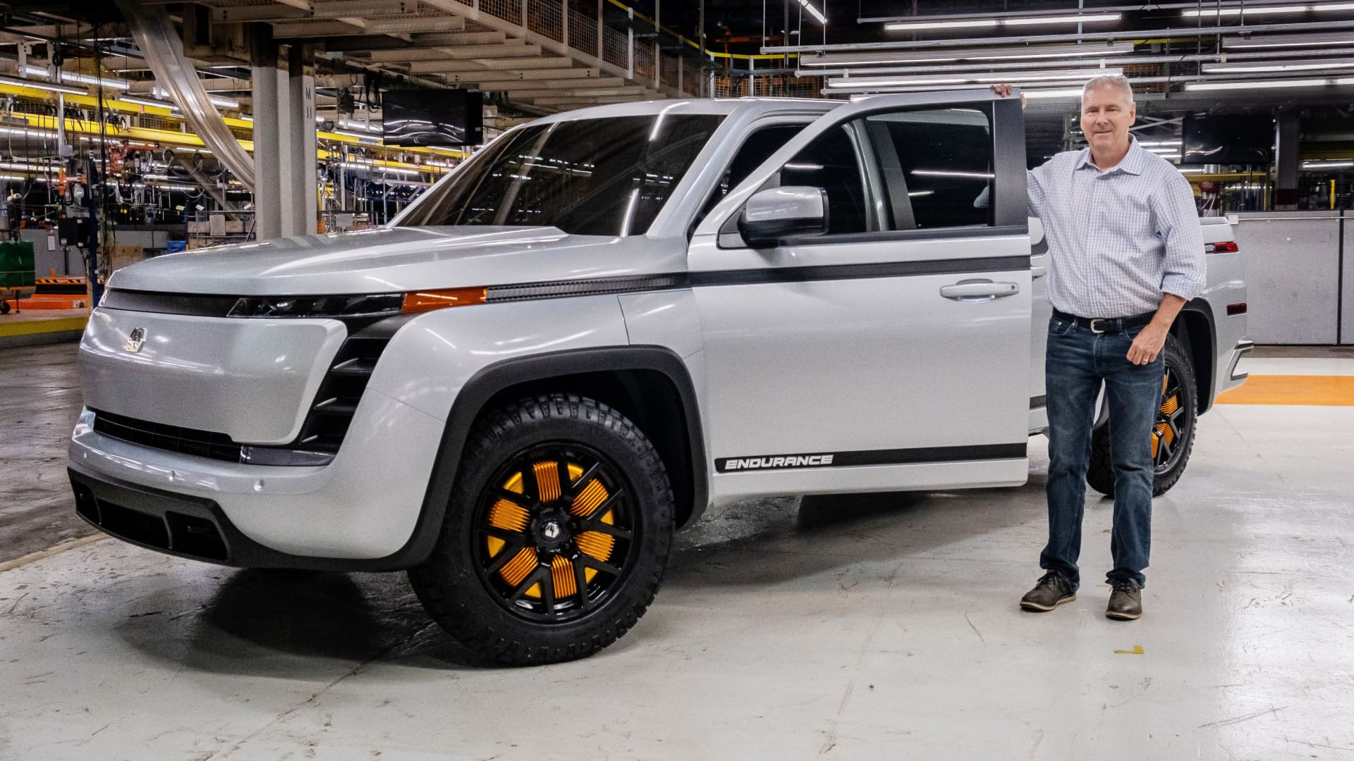 Lordstown Motors Corp Chief Executive Steve Burns poses with a prototype of the electric vehicle start-up's Endurance pickup truck, which it will begin building in the second half of 2021, at the company's plant in Lordstown, Ohio, U.S. June 25, 2020.