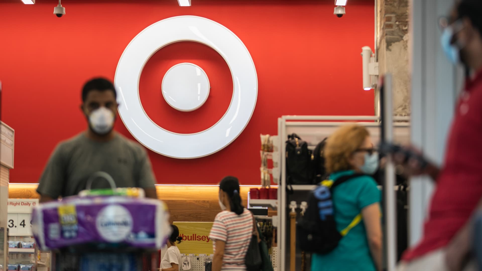 Shoppers wear protective masks inside a Target Corp. store in New York, U.S., on Saturday, Aug. 15, 2020. Target is scheduled to release earnings figures on August 19.