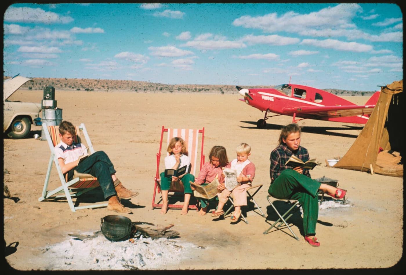 Maye Musk, in the pink shirt, sitting in the Kalahari Desert with her four other siblings.
