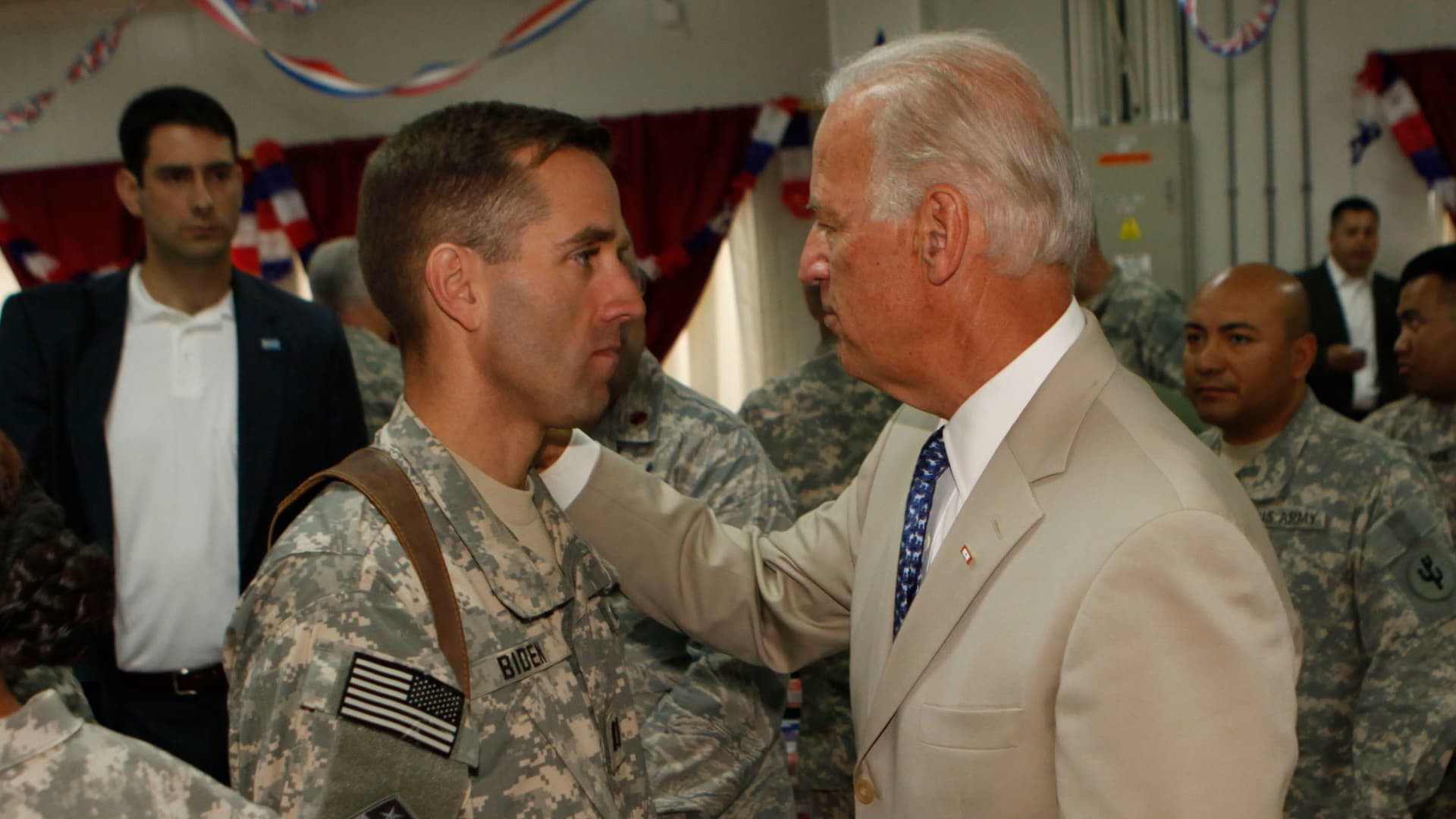 U.S. Vice President Joe Biden talks with his son U.S. Army Capt. Beau Biden (L) at Camp Victory on July 4, 2009 near Baghdad, Iraq. Bidden's first visit to Iraq as the Vice President comes days after U.S. forces pulled out from Iraq's cities.