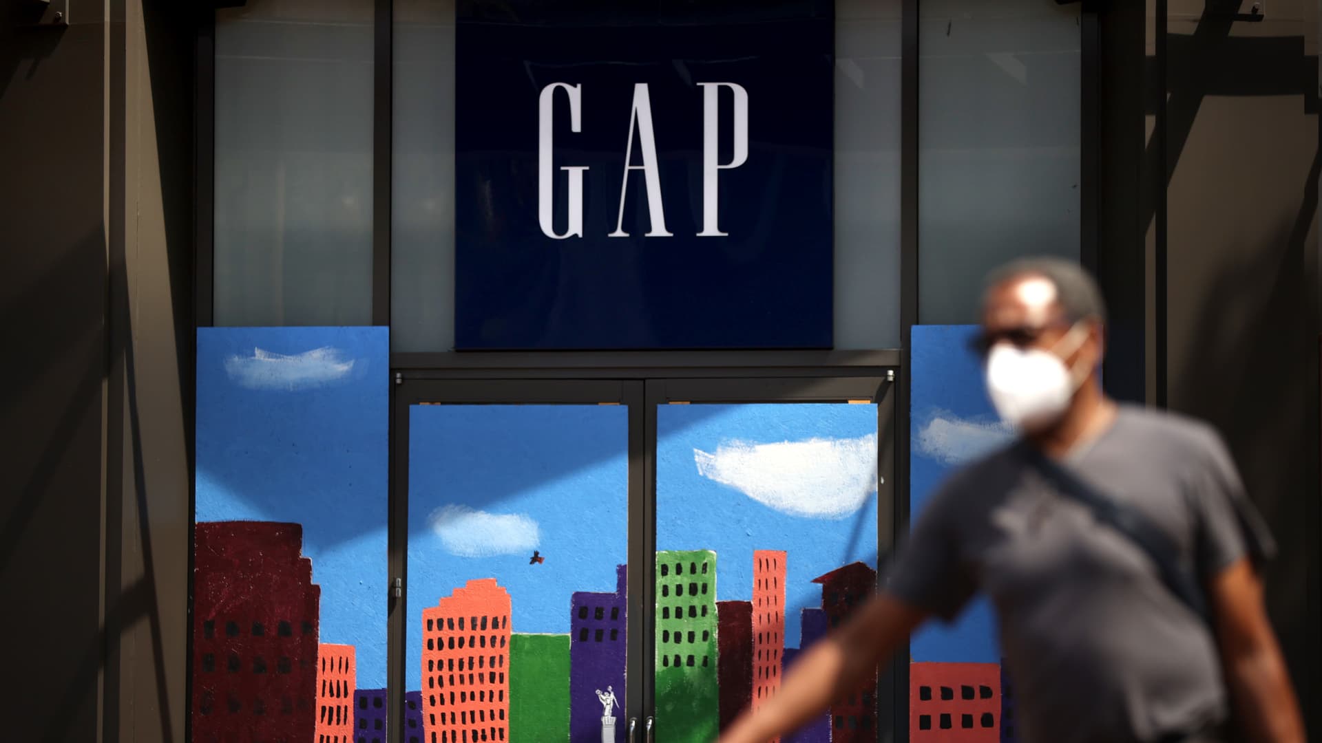 A pedestrian walks by the closed GAP flagship store on August 18, 2020 in San Francisco, California.