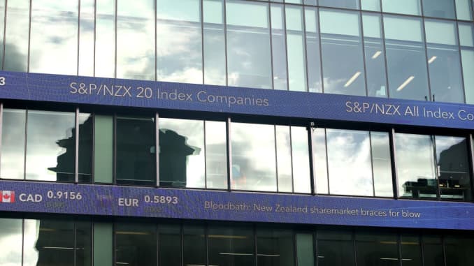 An electronic screen displays international currency rates and the NZ markets on the side of a building on February 7, 2018 in Auckland, New Zealand.
