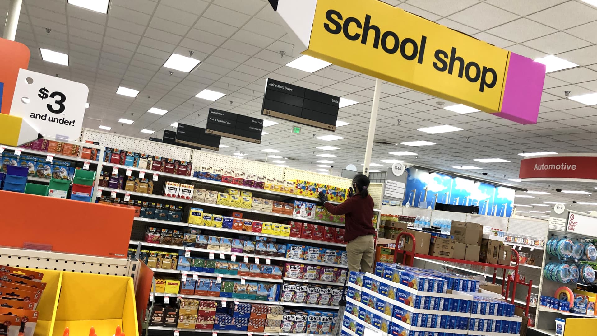 A worker stocks shelves of back-to-school supplies at a Target store on August 03, 2020 in Colma, California.