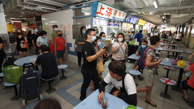 Locals tour Singapore's Chinatown Complex food court during a Hawker Day Out even