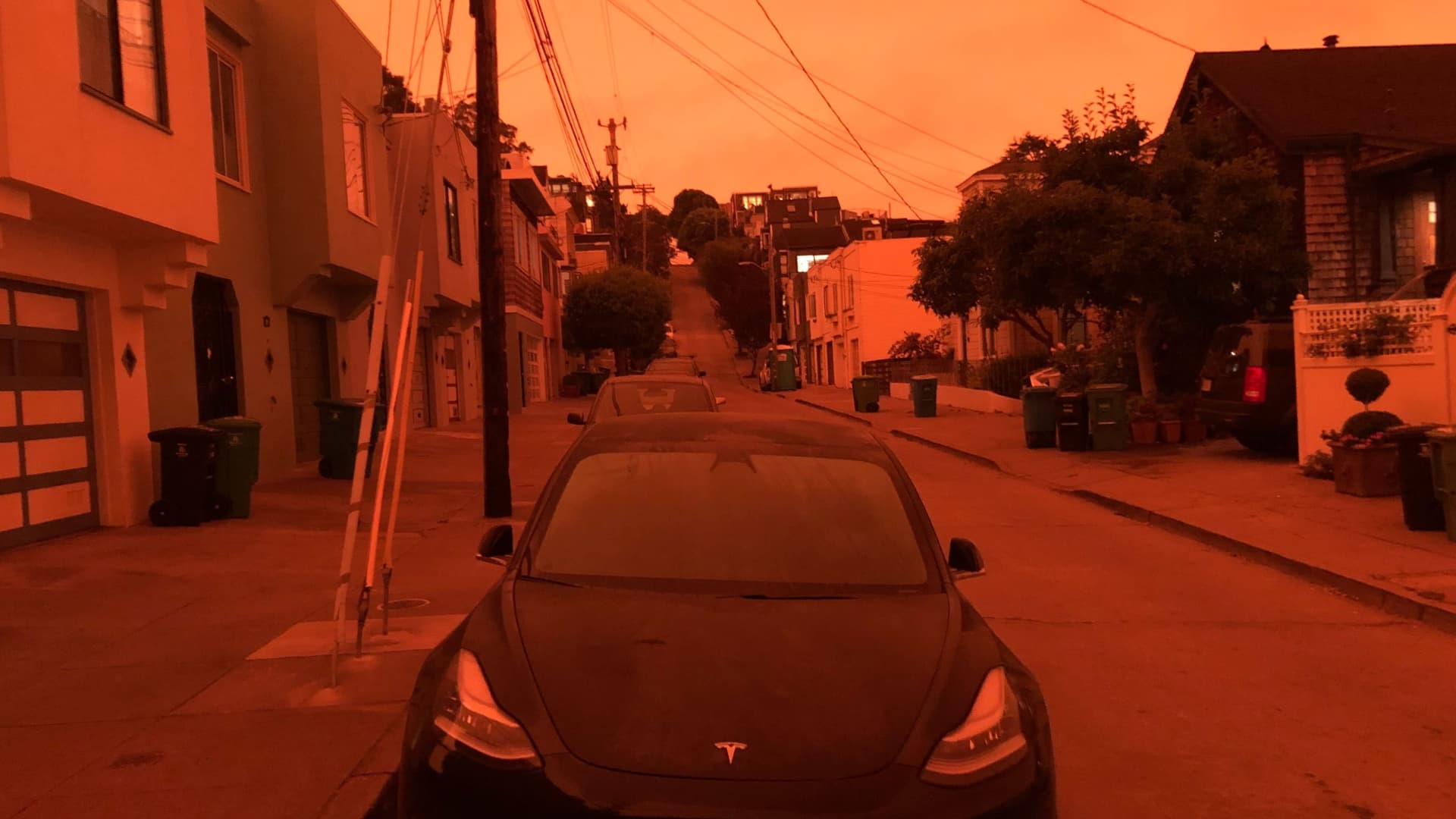 An orange glow suffuses this San Francisco street as wildfire smoke fills the atmosphere on Sept. 9, 2020.