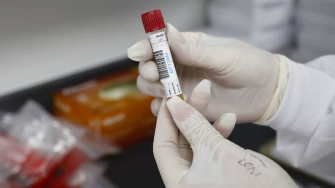 A health worker holds blood samples during clinical trials for a Covid-19 vaccine at Research Centers of America in Hollywood, Florida, on Wednesday, Sept. 9, 2020.