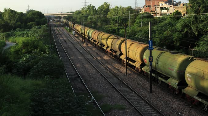 A oil tanker goods train passes towards Nizamuddin Railway Station near Ashram in New Delhi on July 30, 2020.