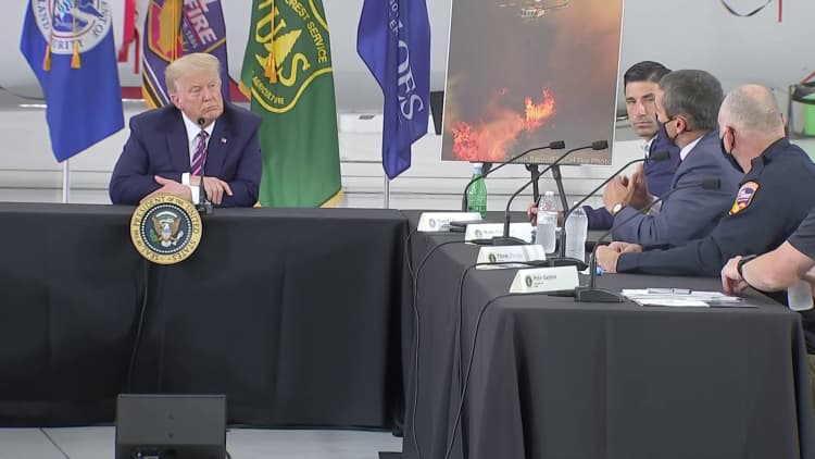 'I wish science agreed with you': Trump challenged on climate change during wildfire briefing in California