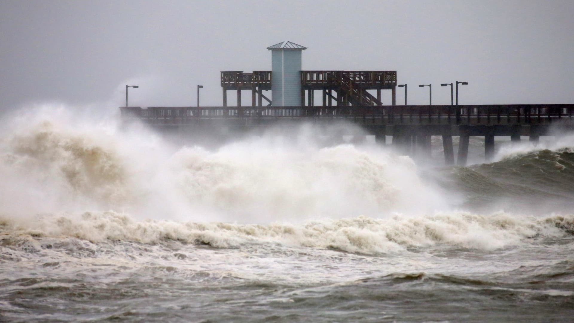 Waves crash along a pier as Hurricane Sally approaches in Gulf Shores, Alabama, U.S., September 15, 2020.
