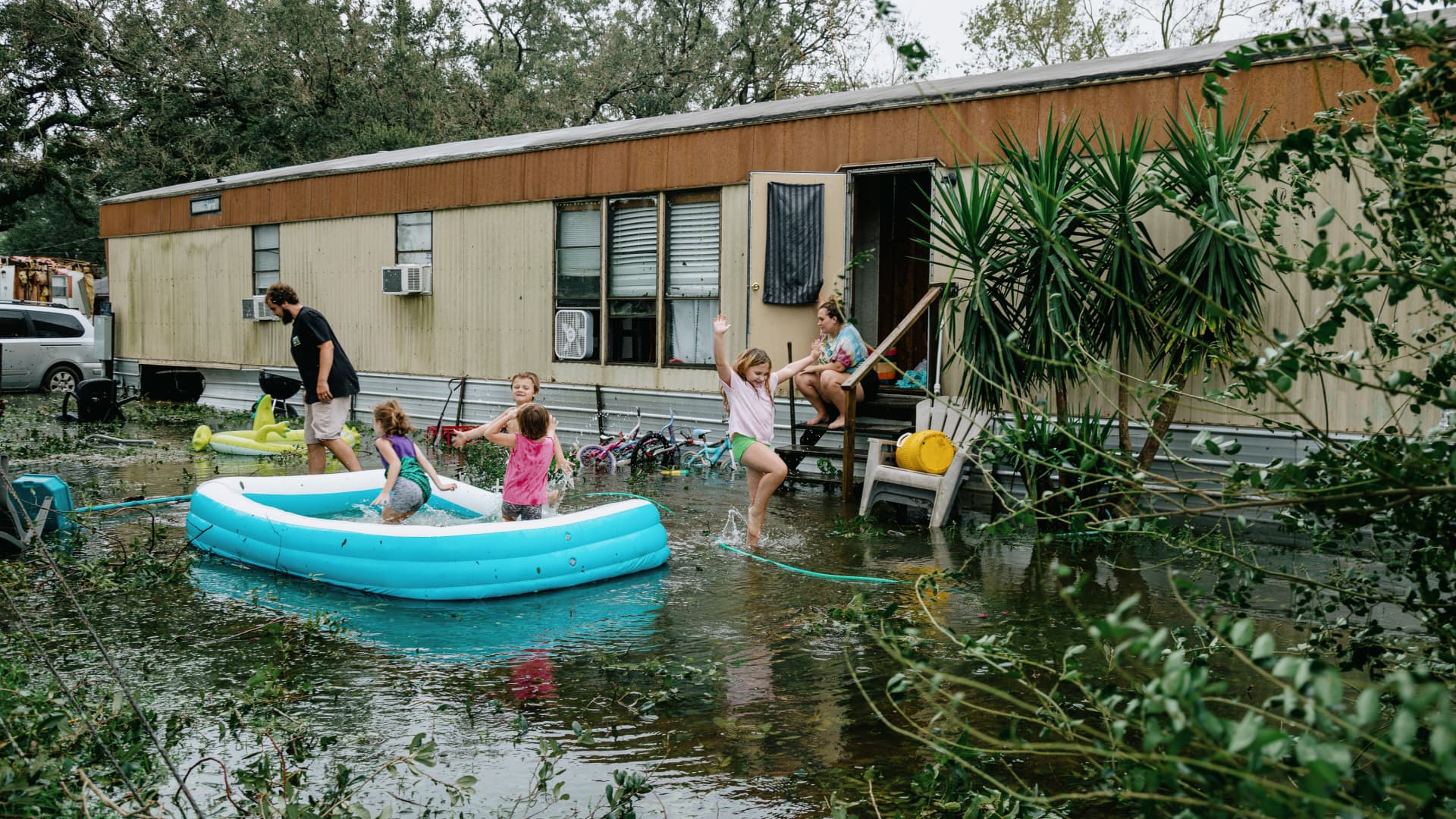 Clinton and Randal Ream with their son Saylor and daughter Nayvie and two neighbors Aubrey Miller and Harmony Morgan at their home in a small trailer park in West Pensacola. The area received a lot of damage after Hurricane Sally came through as a category 2 hurricane in Pensacola, La. on September 16th, 2020.