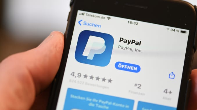 The PayPal application can be seen on a mobile phone.