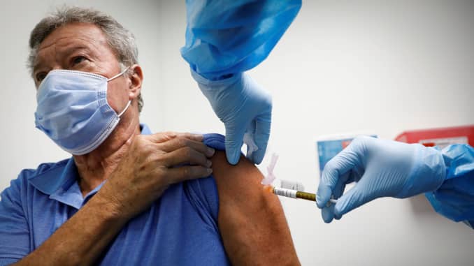 A volunteer is injected with a vaccine as he participates in a coronavirus disease (COVID-19) vaccination study at the Research Centers of America, in Hollywood, Florida, U.S., September 24, 2020.