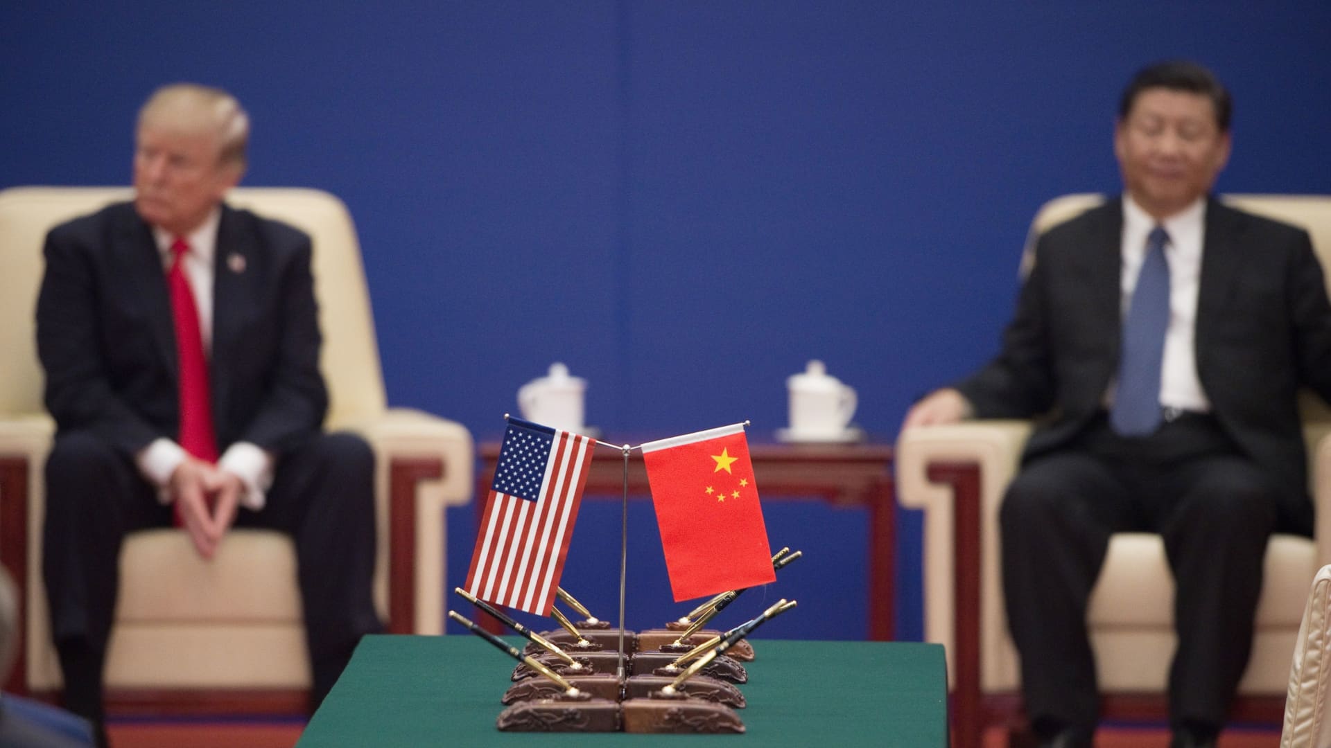 US President Donald Trump and China's President Xi Jinping attend a business leaders event inside the Great Hall of the People in Beijing on November 9, 2017.