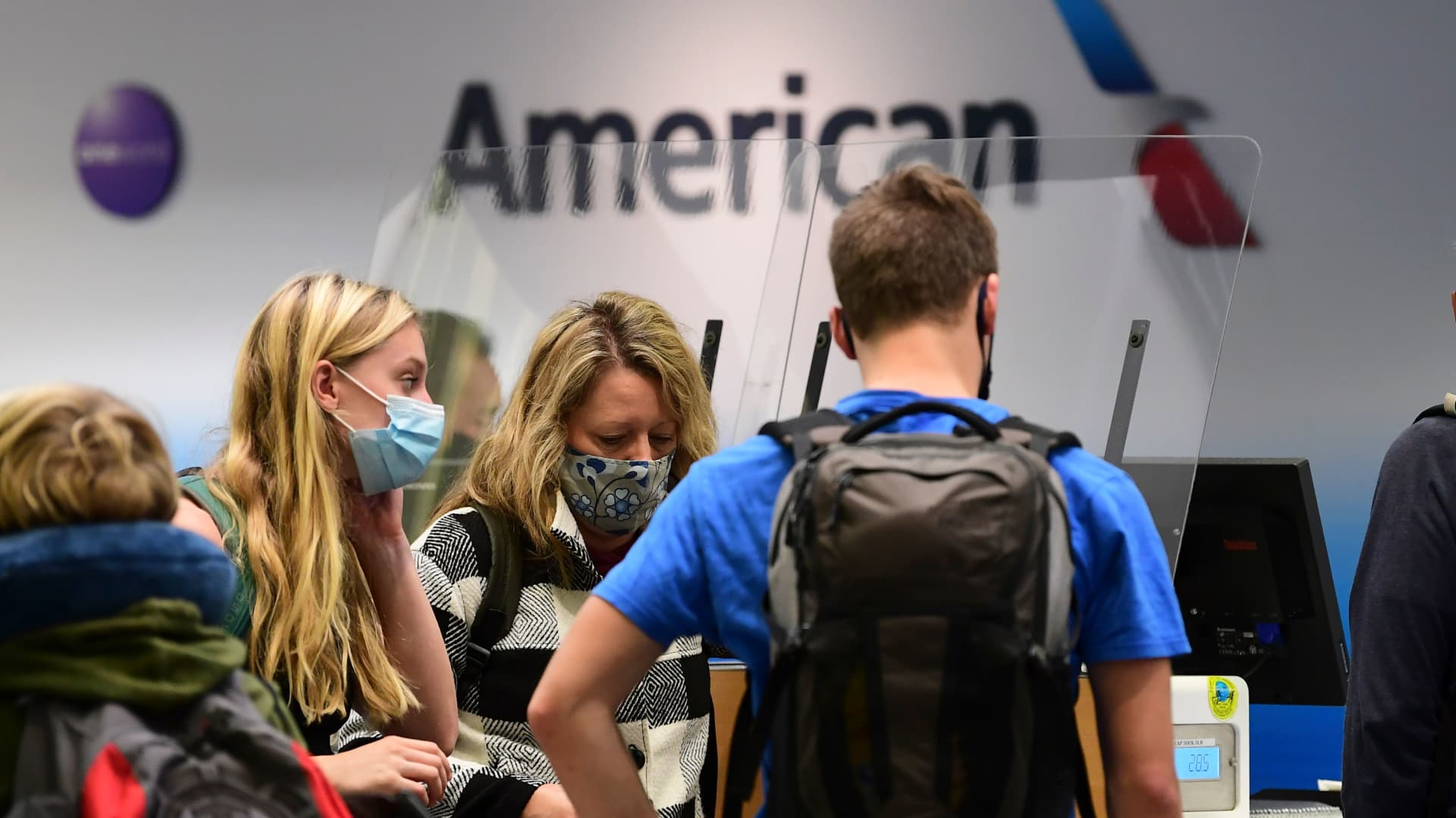 Travelers at the American Airlines check-in counter at Los Angeles International Airport on October 1, 2020.