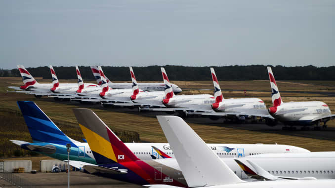 A fleet of Airbus SE A380 passenger aircraft, operated by British Airways, a unit of International Consolidated Airlines Group SA, sit parked near other grounded jets at Chateauroux airport in Chateauroux, France, on Thursday, Aug. 27, 2020.
