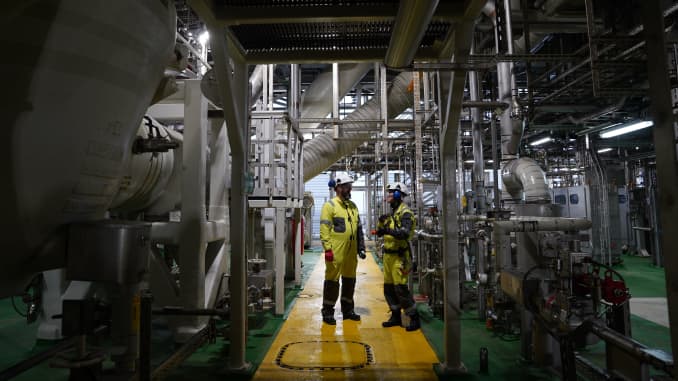 An Equinor employee talks to a reporter on a rig used to produce oil from the Johan Sverdrup oil field some 140 kilometres west from the town of Stavanger, Norway, on December 3, 2019.