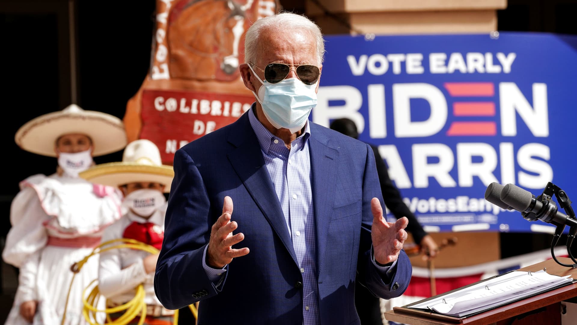 Members of a mariachi band look on as Democratic U.S. presidential nominee Joe Biden discusses the disproportionate ways coronavirus disease (COVID-19) has impacted Latinos in Nevada during a campaign stop at the East Las Vegas Community Center in Las Vegas, Nevada, October 9, 2020.