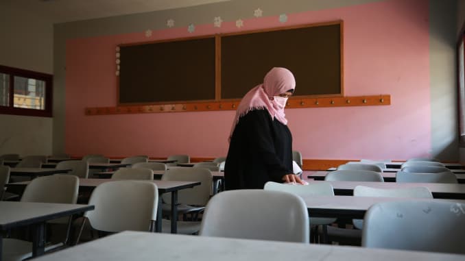 A worker cleans the classes to prepare the school before face-to-face teaching at certain classes on October 10, at Taybe Schools in Khan Yunis, Gaza on October 04, 2020.
