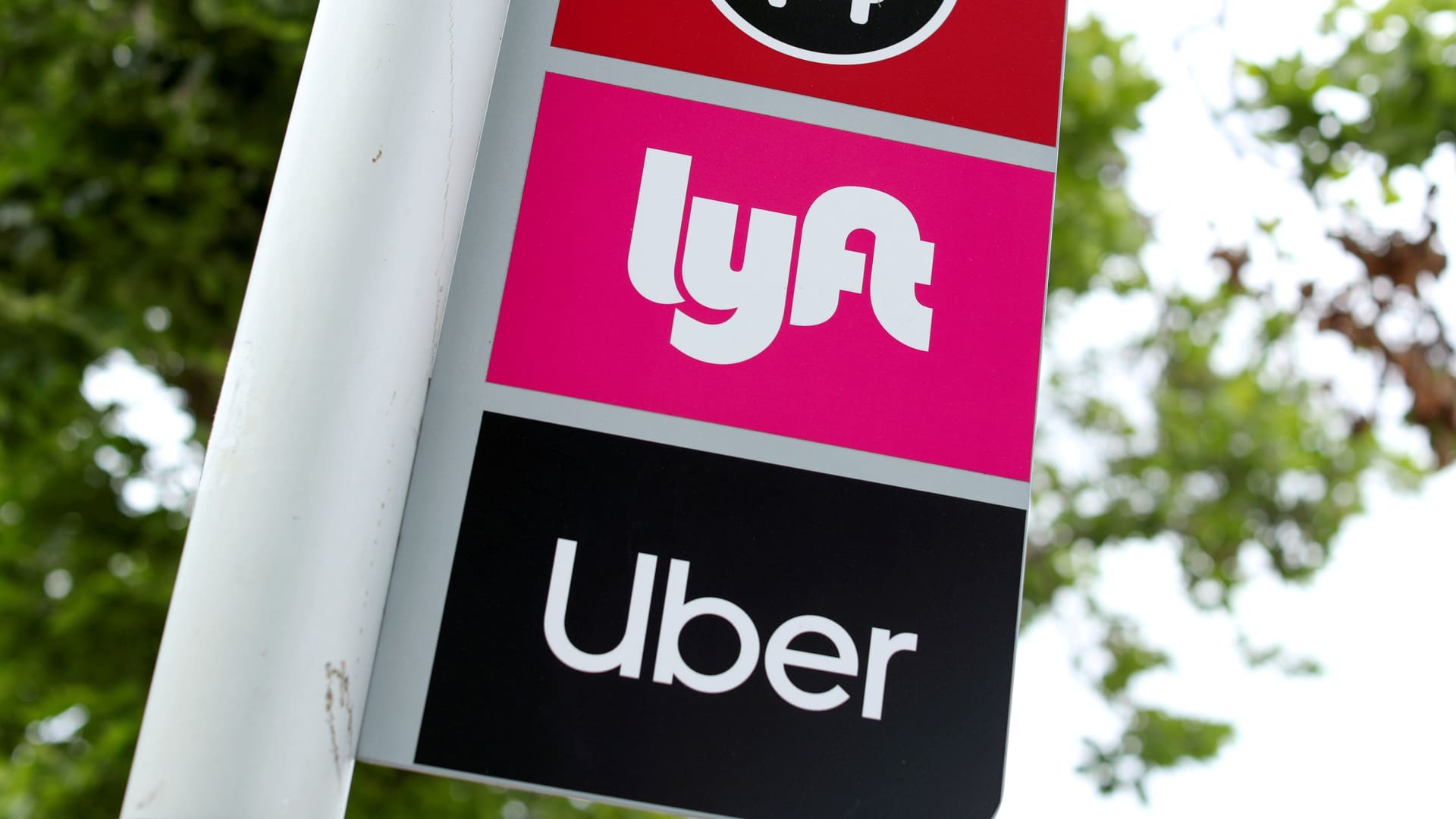 A sign marks a rendezvous location for Lyft and Uber users at San Diego State University in San Diego, California, May 13, 2020.