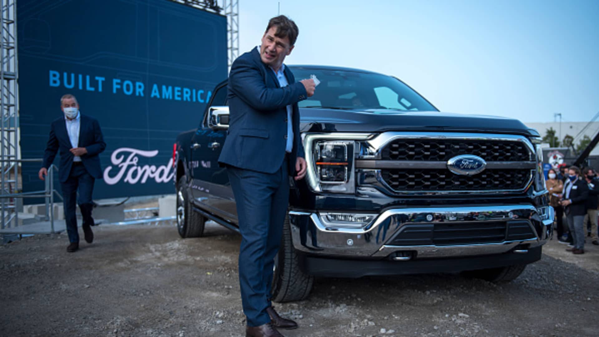Ford CEO Jim Farley takes off his mask at the Ford Built for America event at Fords Dearborn Truck Plant on September 17, 2020 in Dearborn, Michigan.