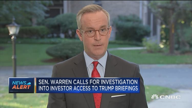 Warren calls for investigation into investor access to Trump briefings