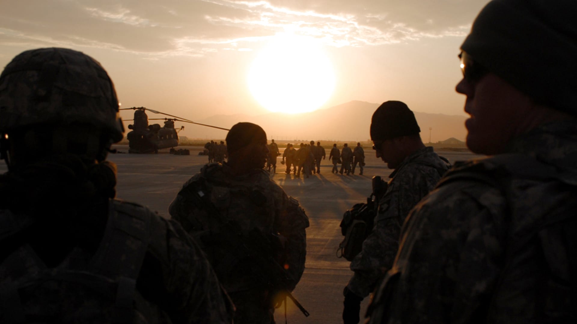 Soldiers from A Co., 101st Division Special Troop Battalion prepare to board a Chinook for an air assault mission Nov. 1, 2005 at Bagram Air Field, Afghanistan.