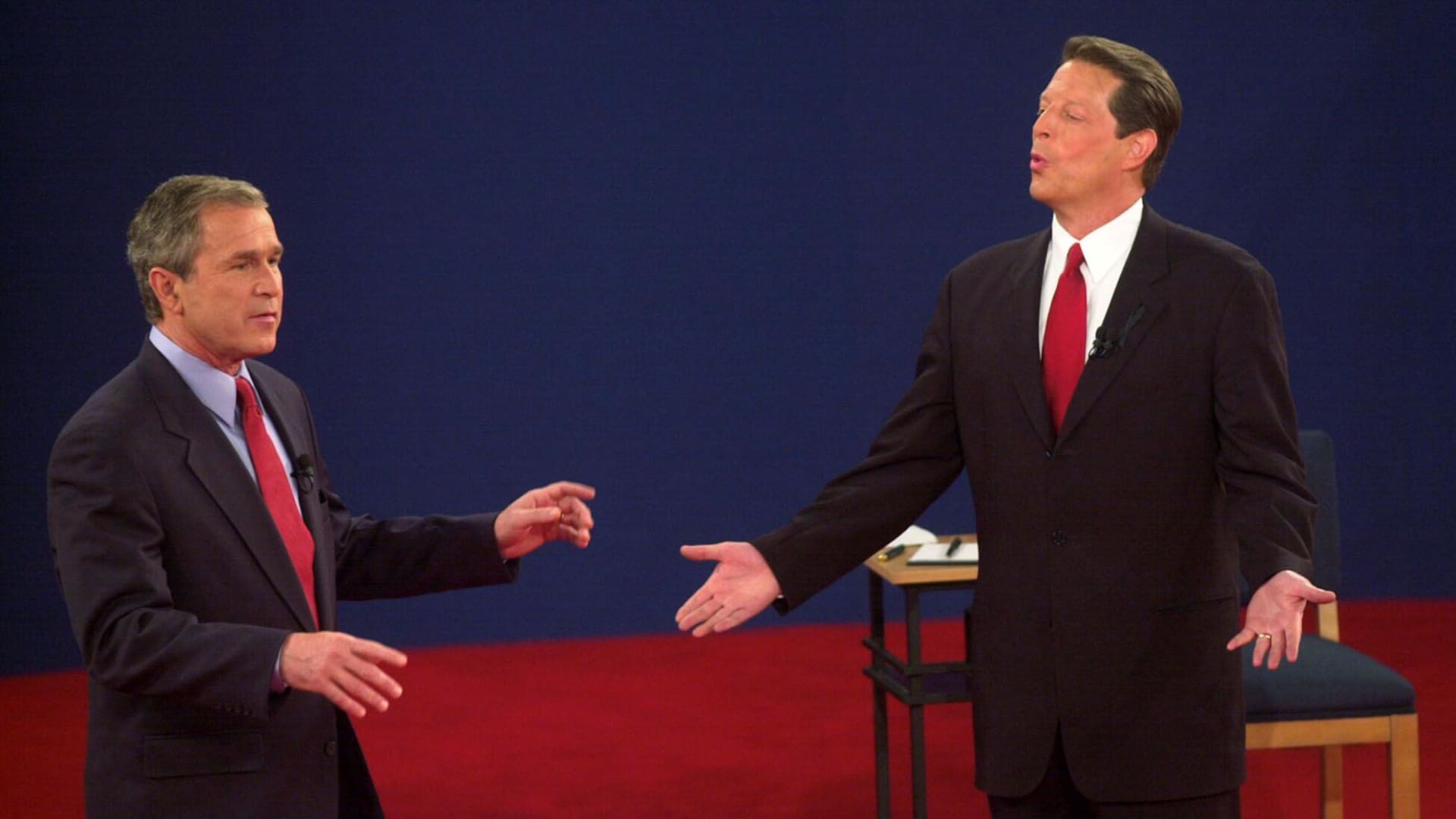 Republican presidential nominee George W. Bush (L) and Democratic presidential nominee Al Gore talk during their third debate at Washington University in St. Louis, MO, 17 October, 2000.