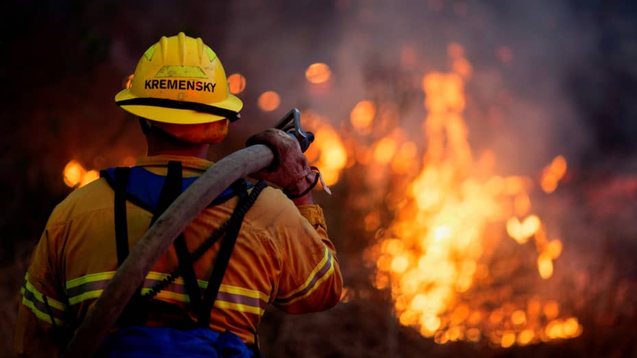 A firefighter battles the Blue Ridge Fire burning in Yorba Linda, California, U.S., October 26, 2020.