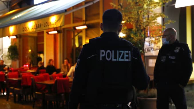 Policemen patrol restaurants along the Bergmanstrasse, one the main shopping street in Kreuzberg district, Berlin.