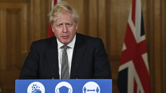 Britain's Prime Minister Boris Johnson speaks during a press conference in 10 Downing Street. (Photo by Alberto Pezzali-Pool/Getty Images)