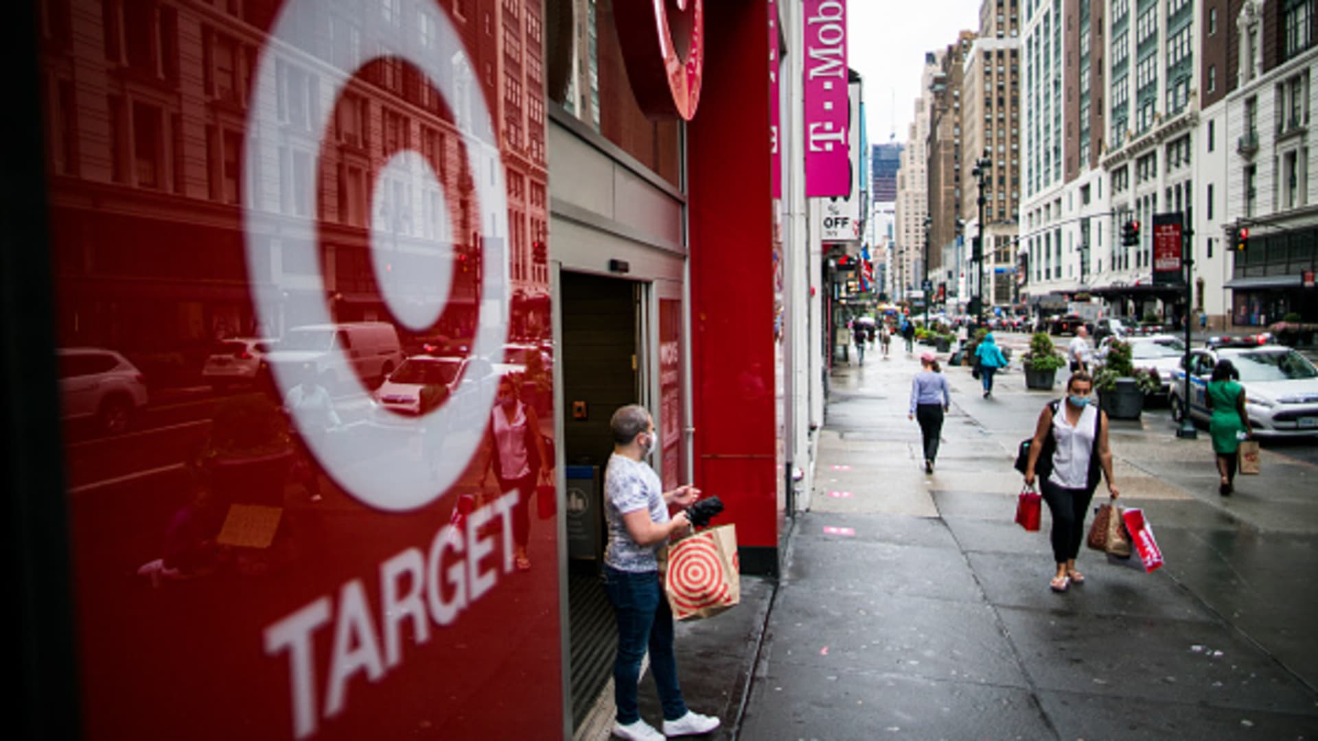People exit Target store in Midtown Manhattan on August 19, 2020 in New York. Target reports earns second quarter, attracting millions of new customers online, setting a record for sales that drove profits up by 80.3% to $1.7 billion.