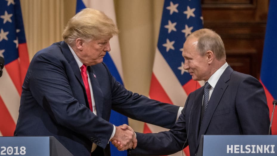 Good chemistry: President Donald Trump and Russian President Vladimir Putin shake hands during a joint press conference after their summit on July 16, 2018 in Helsinki, Finland.
