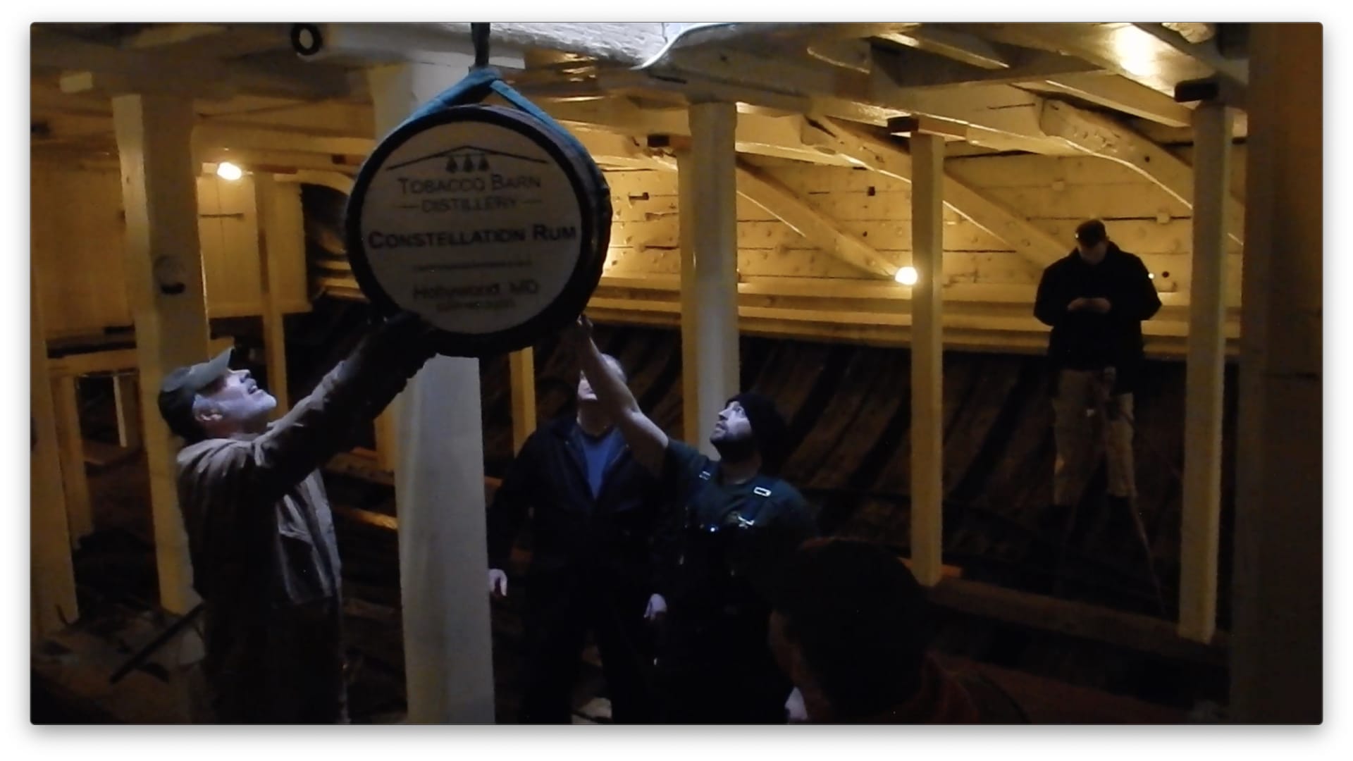 Barrels of rum are lowered into the USS Constellation in Baltimore Harbor.