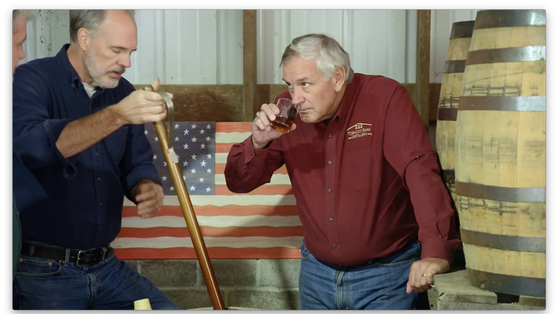 Retired Navy Rear Adm. Scott Sanders, right, and his business partners, Sean Coogan and Dan Dawson, from left, sample bourbon in the Tobacco Barn Distillery's rickhouse.