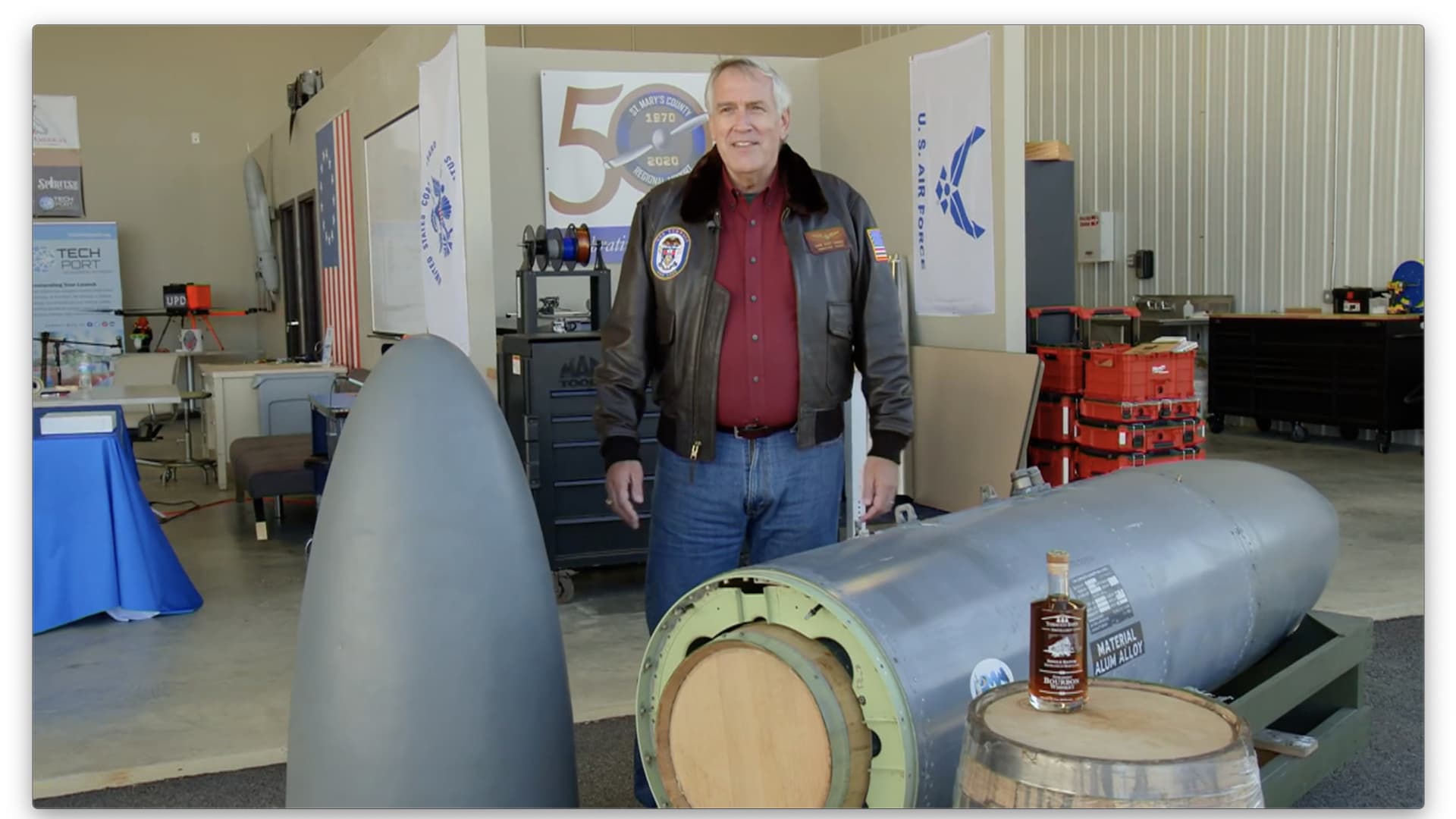 Retired Navy Rear Adm. Scott Sanders explains how the Harrier's reconfigured fuel tank can hold two 25-gallon barrels of bourbon.