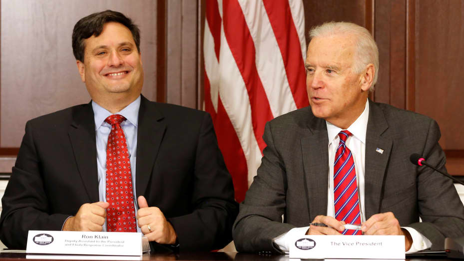 U.S. Vice President Joe Biden (R) is joined by Ebola Response Coordinator Ron Klain (L) in the Eisenhower Executive Office Building on the White House complex in Washington, U.S. November 13, 2014.