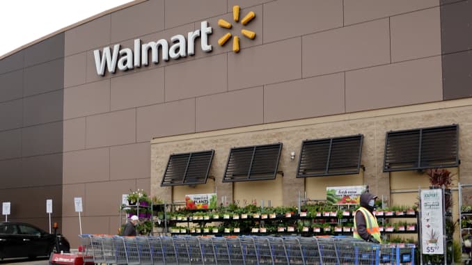 A worker collects shopping carts at a Walmart store on May 19, 2020 in Chicago, Illinois. Walmart reported a 74% increase in U.S. online sales for the quarter that ended April 30, and a 10% increase in same store sales for the same period as the effects o
