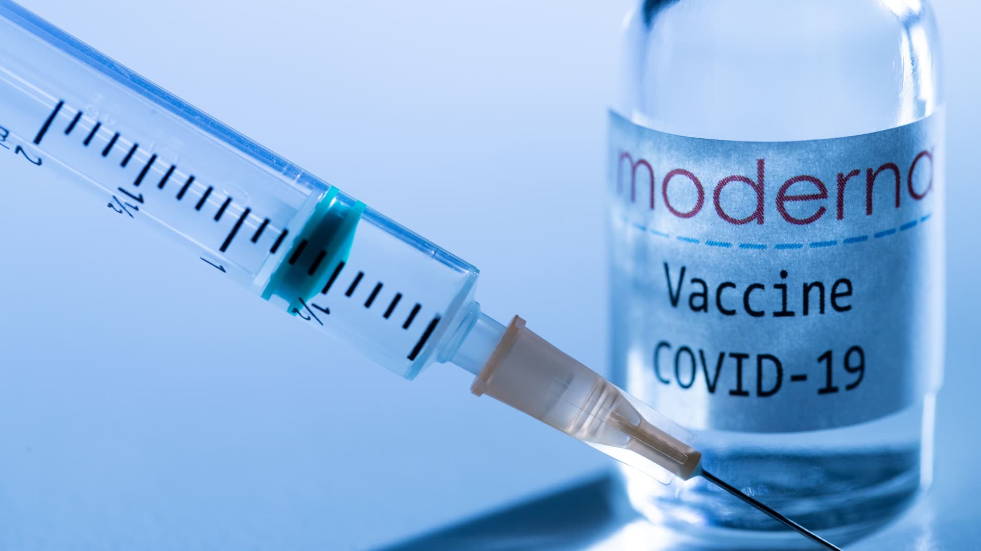 This creative image taken in a studio in Paris on November 16, 2020, showing a syringe and a vaccine vial with the reproducted logo of a US biotech firm Moderna, illustrates the announcement of an experimental vaccine against Covid-19 from Moderna that would be nearly 95% effective, marking a second major step forward in the quest to end the Covid-19 pandemic.
