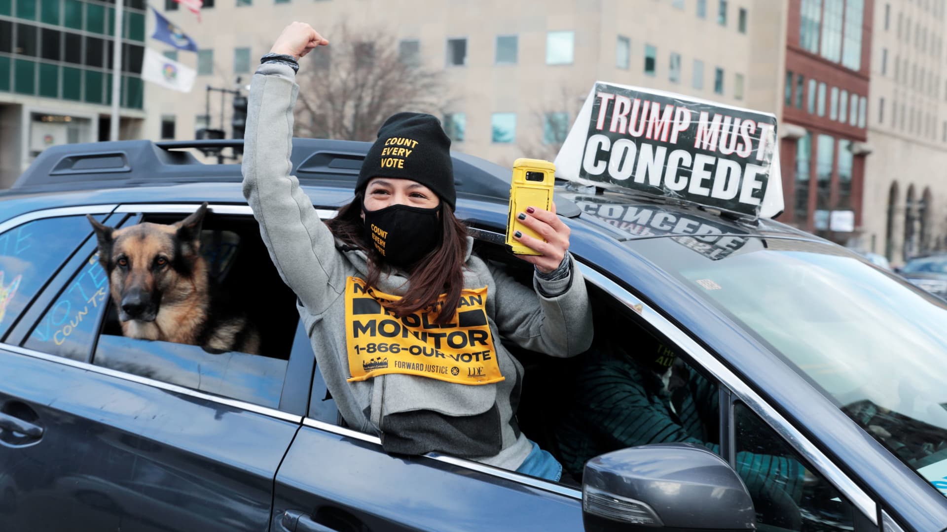 Demonstrators in a car caravan demand the Board of State Canvassers to certify the results of the election in Lansing, Michigan, November 23, 2020.