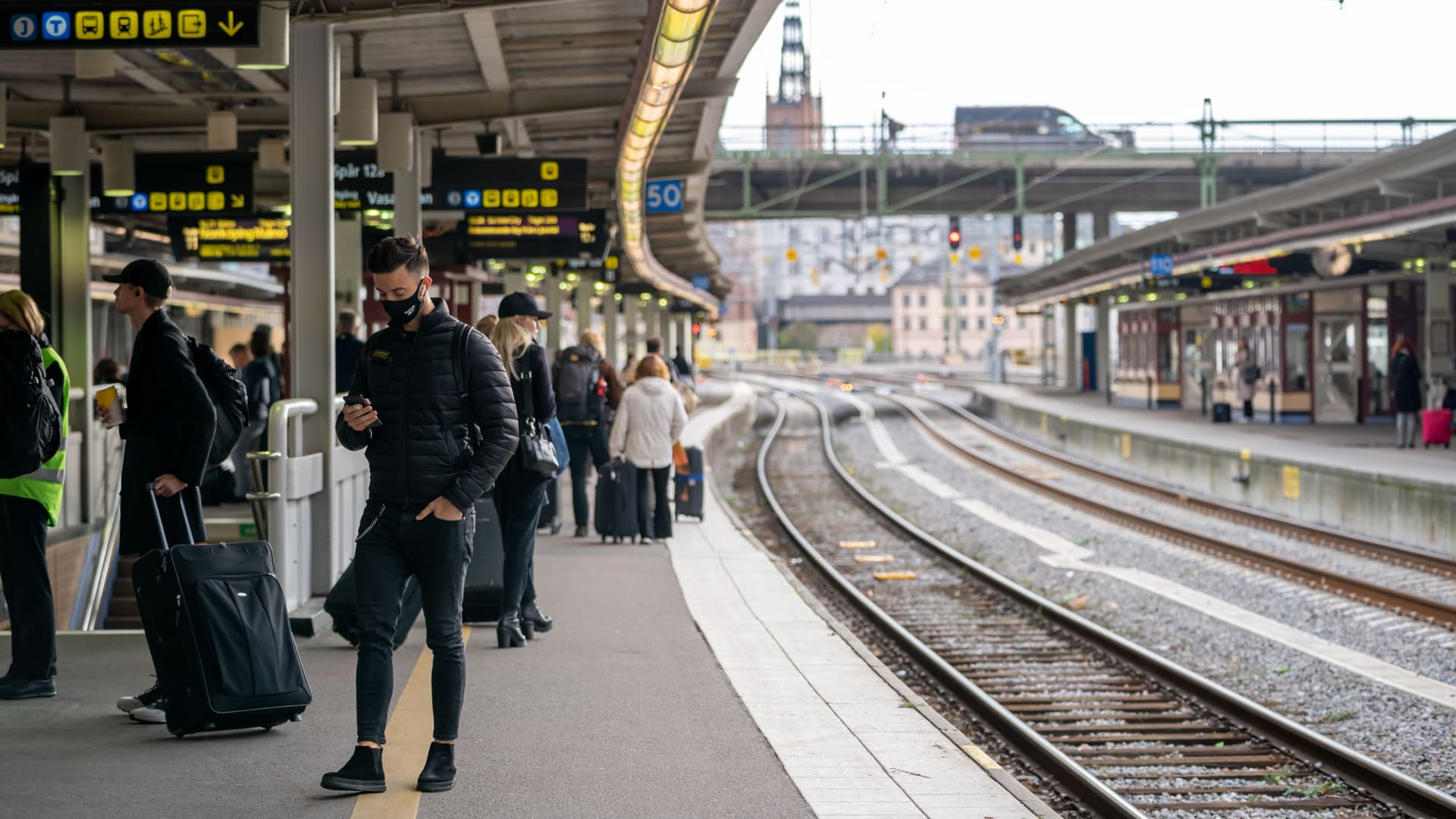 A man wearing a face mask waits for a train in the central train station during the COVID-19 pandemic in Stockholm, capital of Sweden, on Nov. 3, 2020.
