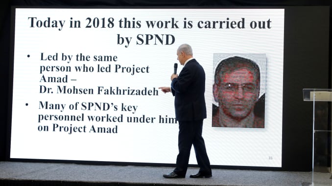 Israeli Prime Minister Benjamin Netanyahu points at a screen with an image of Iranian nuclear scientist Mohsen Fakhrizadeh during a news conference at the Ministry of Defence in Tel Aviv, Israel, April 30, 2018.