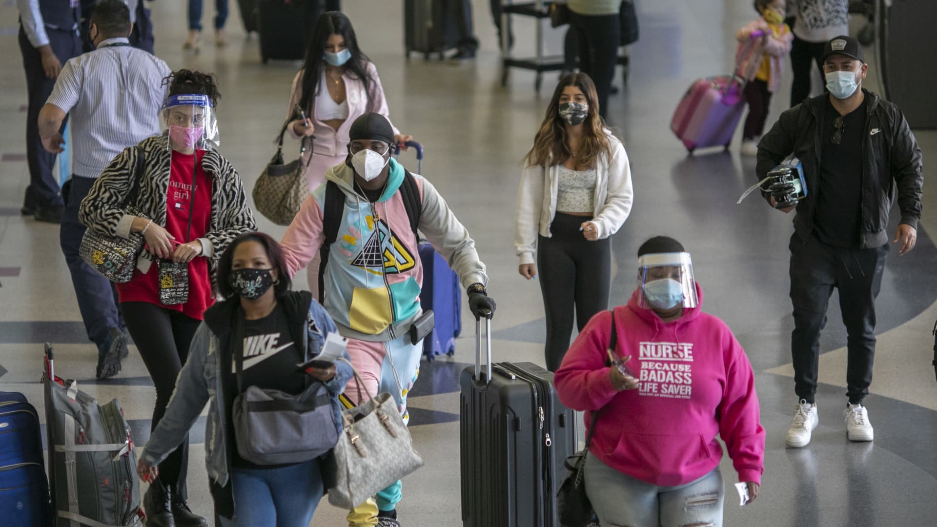 Holiday travelers pass through Los Angeles international Airport on Thanksgiving eve as the COVID-19 spike worsens and stay-at-home restrictions are increased on November 25, 2020 in West Hollywood, California.
