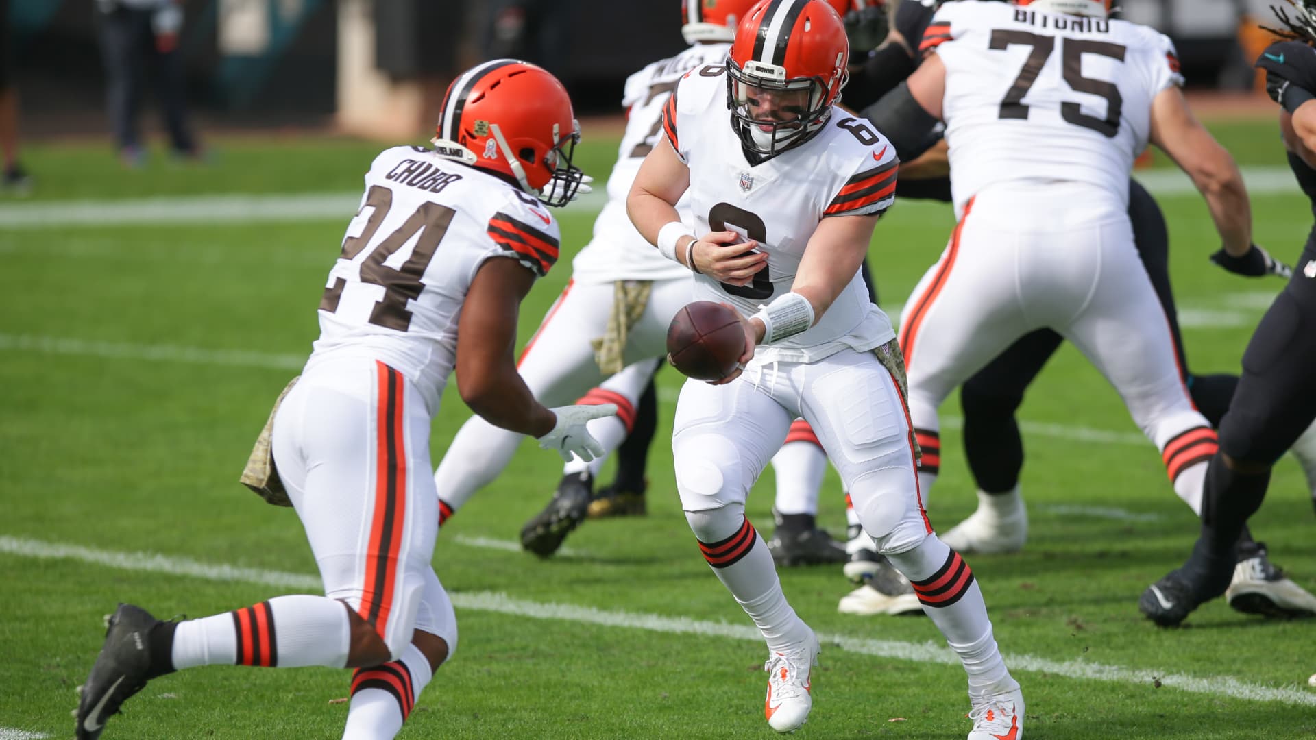 Cleveland Browns Quarterback Baker Mayfield (6) hands off to Cleveland Browns Running Back Nick Chubb (24) during the game between the Cleveland Browns and the Jacksonville Jaguars on November 29, 2020 at TIAA Bank Field in Jacksonville, Fl.