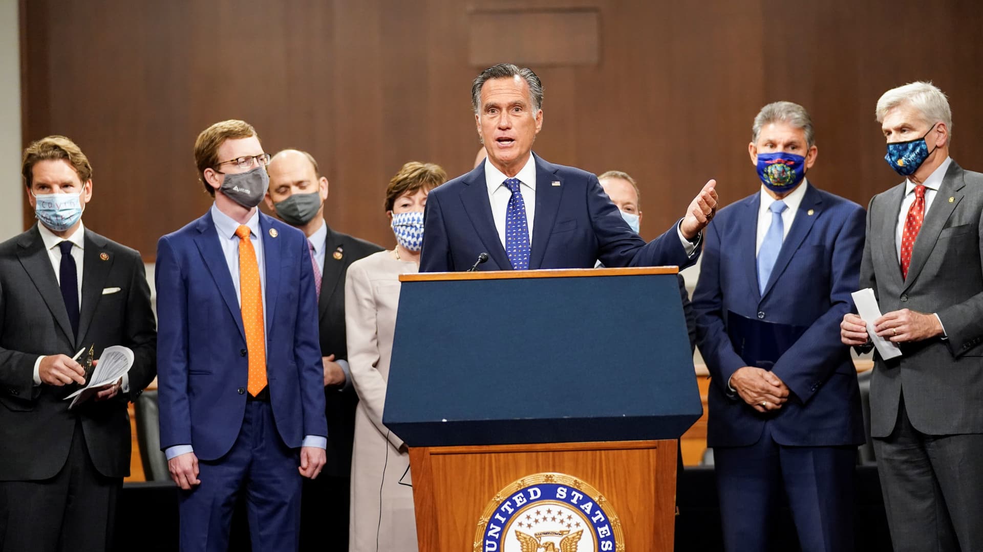 Sen. Mitt Romney (R-Utah) speaks as bipartisan members of the Senate and House gather to announce a framework for fresh coronavirus relief legislation at a news conference on Capitol Hill on Dec. 1, 2020.